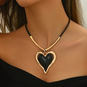 A Simple Yet Extravagant Oversized Heart-Shaped Pendant Necklace with a Black Cord, Perfect for Everyday Wear And As a Valentine'S Day Gift for Women.