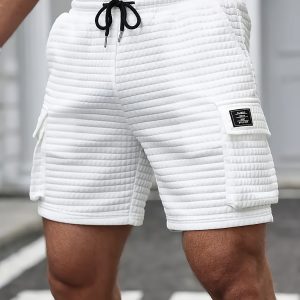Summer Men's casual shorts, waist drawstring, waffle textured polyester blend fabric, covered pockets and fashionable label details - perfect for casual wear and commuting